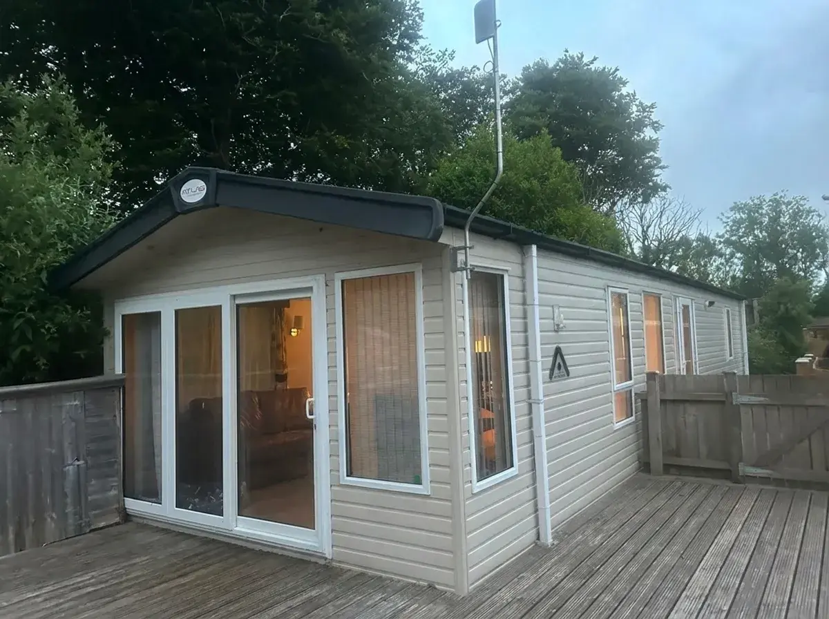 Cornwall Lodge exterior with private decking, Broadway estate, Laugharne