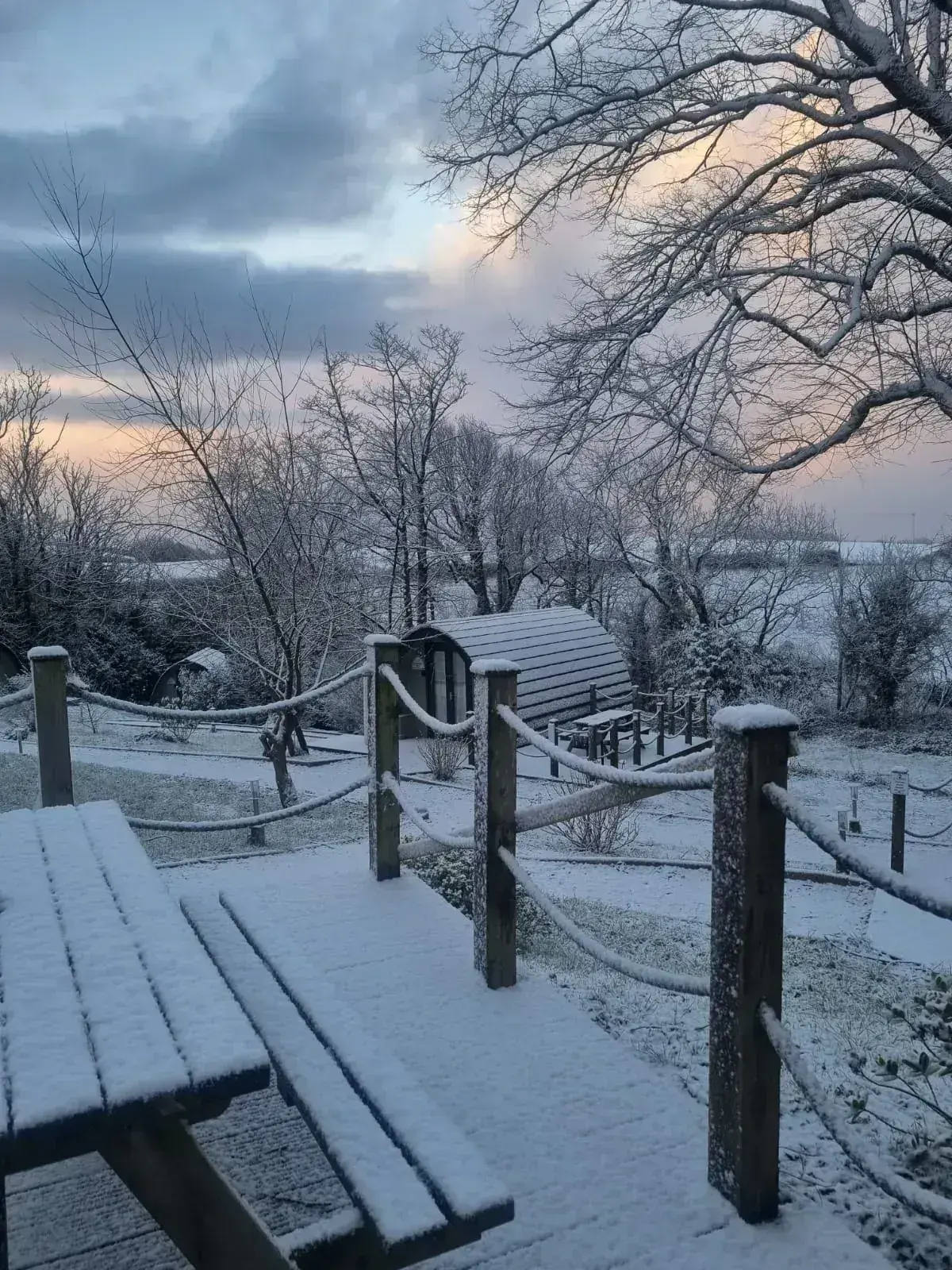 Pods @ Broadway grounds blanketed in snow at sunset — stunning winter scene